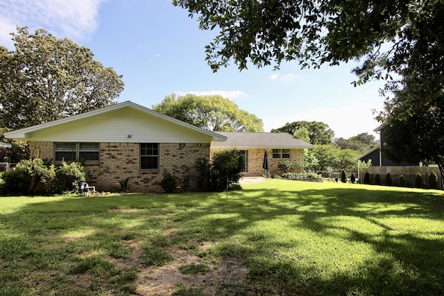 35 Birch Ave, Shalimar, FL 32579 - rear view of house featuring brick siding