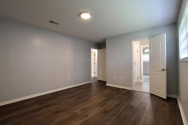 35 Birch Ave, Shalimar, FL 32579 - unfurnished bedroom featuring dark wood-type flooring and baseboards