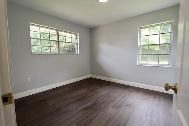 35 Birch Ave, Shalimar, FL 32579 - empty room featuring dark wood-style floors and baseboards