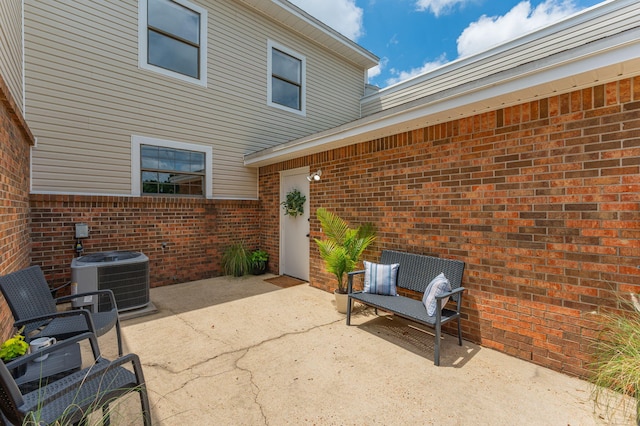 128 5th Ave, Shalimar, FL 32579 - view of patio featuring central AC unit