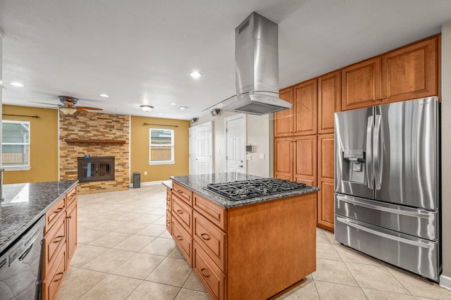 3 NE Windsor Ln, Fort Walton Beach, FL 32547 - kitchen with stainless steel refrigerator with ice dispenser, island range hood, light tile patterned floors, black gas cooktop, and ceiling fan