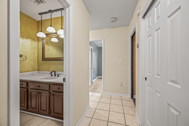 3 NE Windsor Ln, Fort Walton Beach, FL 32547 - bathroom with vanity, tile patterned flooring, and baseboards