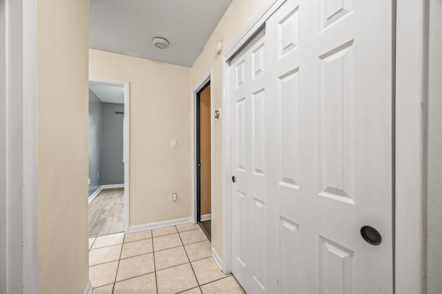 3 NE Windsor Ln, Fort Walton Beach, FL 32547 - corridor with baseboards and light tile patterned floors