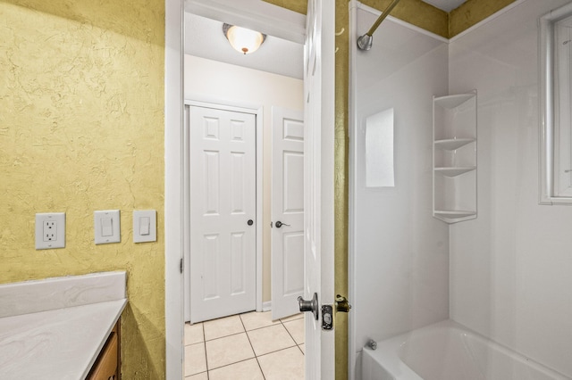 3 NE Windsor Ln, Fort Walton Beach, FL 32547 - bathroom featuring tile patterned floors, tub / shower combination, vanity, and a textured wall