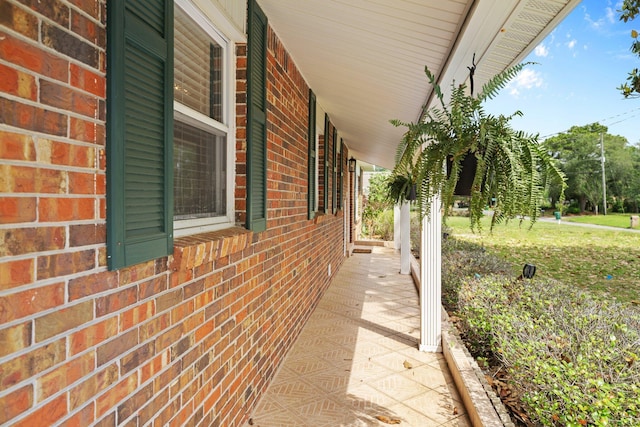 197 Country Club Rd, Shalimar, FL 32579 - view of side of home featuring covered porch and brick siding