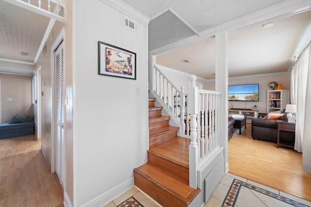 197 Country Club Rd, Shalimar, FL 32579 - stairway with crown molding, inlaid floor details, wood finished floors, and baseboards