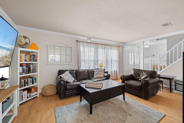 197 Country Club Rd, Shalimar, FL 32579 - living area with light wood-type flooring, crown molding, stairs, and a textured ceiling
