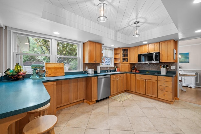 197 Country Club Rd, Shalimar, FL 32579 - kitchen featuring appliances with stainless steel finishes, backsplash, a raised ceiling, dark countertops, and open shelves