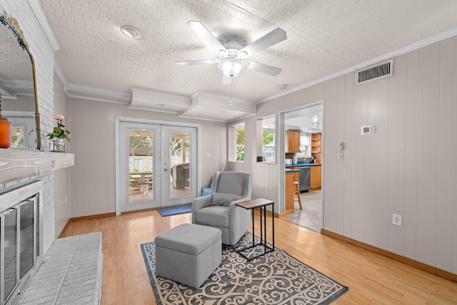 197 Country Club Rd, Shalimar, FL 32579 - living area featuring light wood finished floors, a ceiling fan, ornamental molding, a brick fireplace, and baseboards