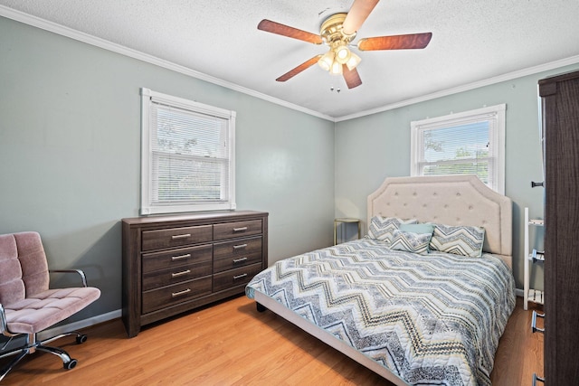 197 Country Club Rd, Shalimar, FL 32579 - bedroom featuring light wood-type flooring, crown molding, ceiling fan, a textured ceiling, and baseboards