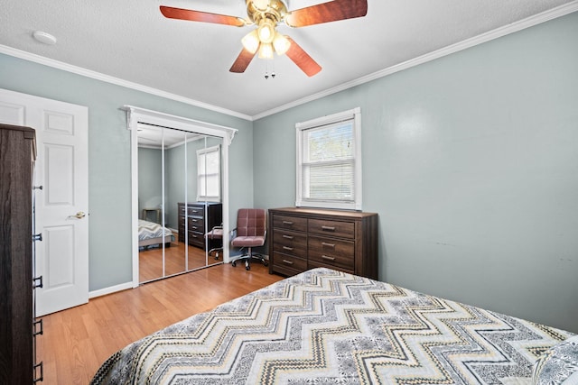 197 Country Club Rd, Shalimar, FL 32579 - bedroom featuring wood finished floors, ornamental molding, a closet, and ceiling fan