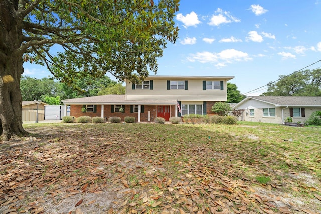 197 Country Club Rd, Shalimar, FL 32579 - traditional home featuring brick siding and fence