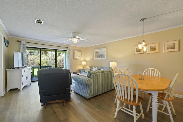 3755 Scenic Highway 98 Unit 1601, Destin, FL 32541 - living area with wood finished floors, a textured ceiling, crown molding, a ceiling fan, and baseboards