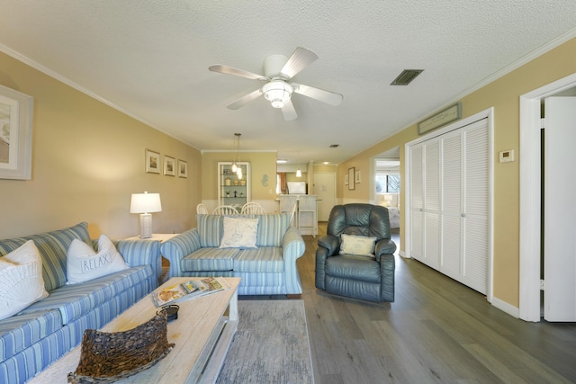 3755 Scenic Highway 98 Unit 1601, Destin, FL 32541 - living room featuring wood finished floors, ceiling fan, crown molding, a textured ceiling, and baseboards