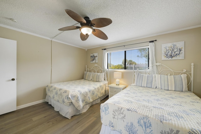 3755 Scenic Highway 98 Unit 1601, Destin, FL 32541 - bedroom featuring ornamental molding, wood finished floors, a textured ceiling, a ceiling fan, and baseboards