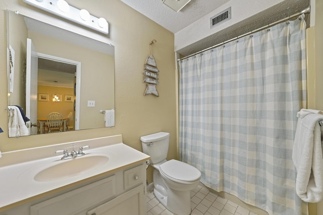 3755 Scenic Highway 98 Unit 1601, Destin, FL 32541 - full bath with tile patterned floors, toilet, vanity, curtained shower, and a textured ceiling
