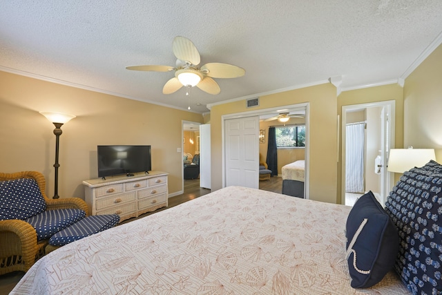 3755 Scenic Highway 98 Unit 1601, Destin, FL 32541 - bedroom featuring crown molding, a textured ceiling, a ceiling fan, and wood finished floors