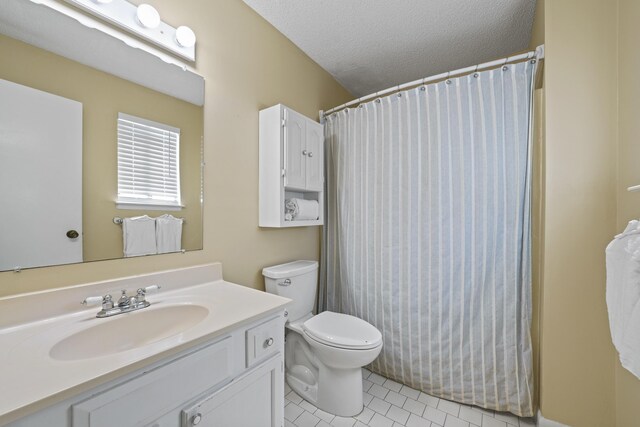 3755 Scenic Highway 98 Unit 1601, Destin, FL 32541 - full bath featuring tile patterned flooring, toilet, vanity, a textured ceiling, and a shower with curtain