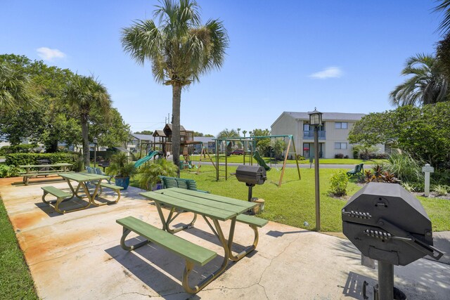 3755 Scenic Highway 98 Unit 1601, Destin, FL 32541 - view of property's community featuring a lawn and a patio