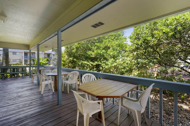 3755 Scenic Highway 98 Unit 1601, Destin, FL 32541 - wooden deck featuring outdoor dining space