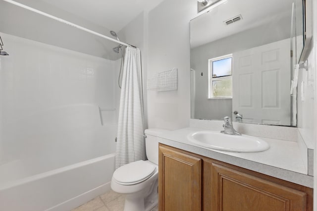 bathroom with toilet, vanity, shower / tub combo, and tile patterned flooring
