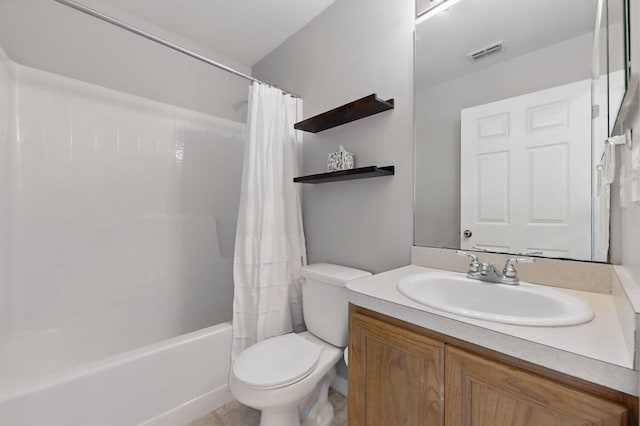 full bathroom featuring toilet, vanity, shower / bath combo with shower curtain, and tile patterned flooring