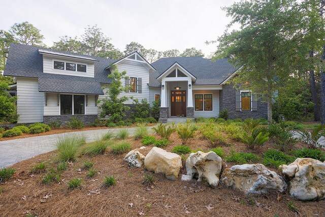 1807 Lost Cove Ct, Panama City Beach, FL 32413 - view of front of home with stone siding and roof with shingles