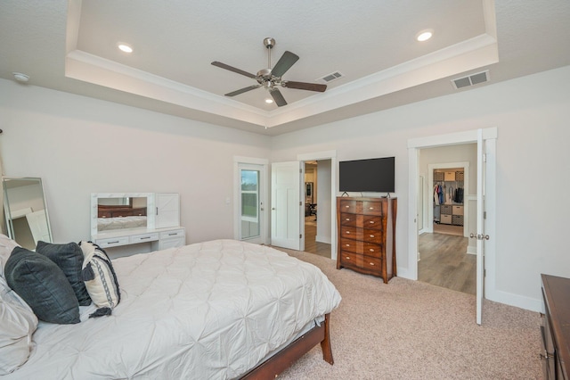 602 Champ Trl, Crestview, FL 32539 - bedroom featuring a tray ceiling, carpet, recessed lighting, a spacious closet, and crown molding