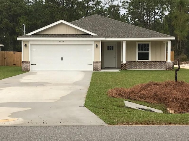 view of front facade with brick siding, driveway, an attached garage, a shingled roof, and covered porch