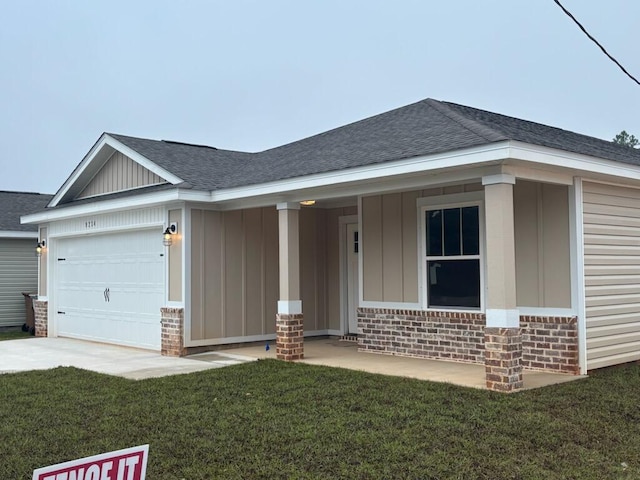 view of front of house featuring brick siding, board and batten siding, a garage, and a shingled roof