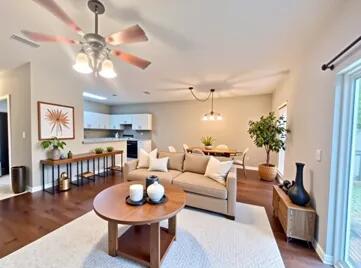 1413 Beaver Run Rd Unit 7, Niceville, FL 32578 - living room featuring wood finished floors, a ceiling fan, and baseboards