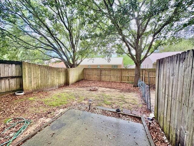 1413 Beaver Run Rd Unit 7, Niceville, FL 32578 - fenced backyard featuring a patio