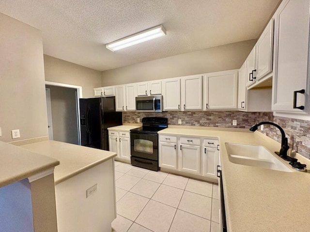 1413 Beaver Run Rd Unit 7, Niceville, FL 32578 - kitchen featuring black appliances, backsplash, white cabinetry, light tile patterned floors, and a textured ceiling