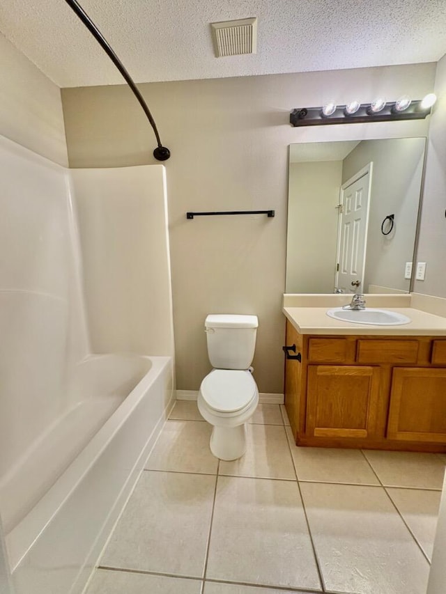 1413 Beaver Run Rd Unit 7, Niceville, FL 32578 - bathroom with vanity, tile patterned flooring, a textured ceiling, and shower / tub combination