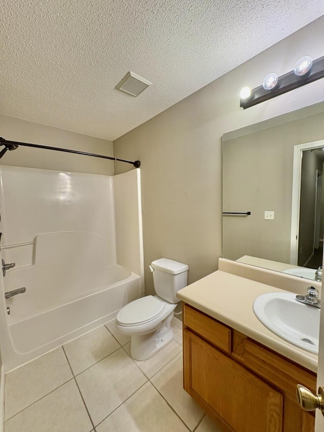1413 Beaver Run Rd Unit 7, Niceville, FL 32578 - bathroom featuring washtub / shower combination, vanity, tile patterned flooring, and a textured ceiling