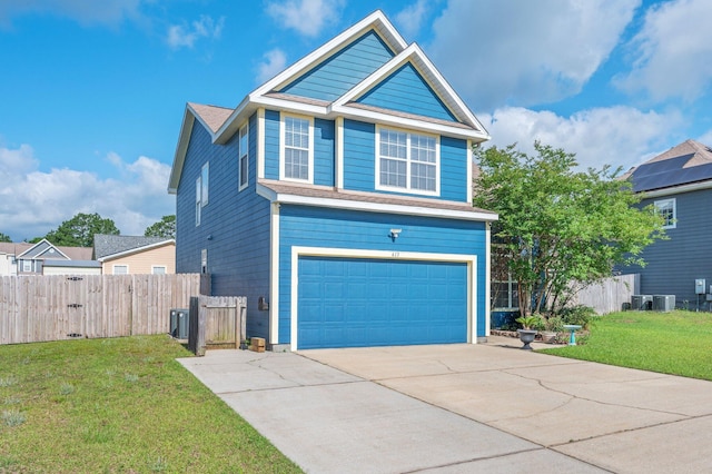 613 Prairie St, Crestview, FL 32536 - view of front facade with a garage, driveway, and cooling unit