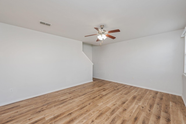 613 Prairie St, Crestview, FL 32536 - unfurnished room with ceiling fan, light wood-style flooring, and baseboards