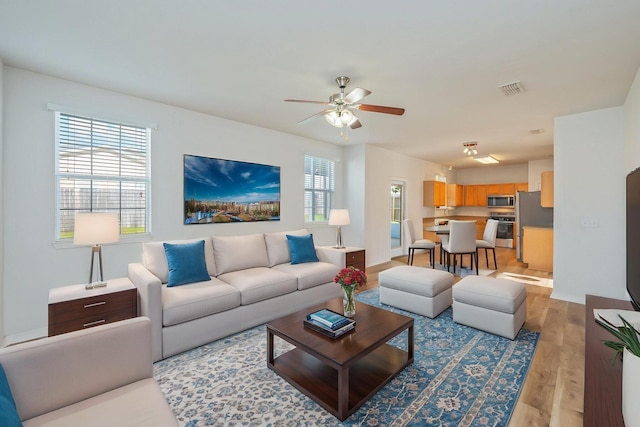 613 Prairie St, Crestview, FL 32536 - living room featuring light wood-type flooring and a ceiling fan