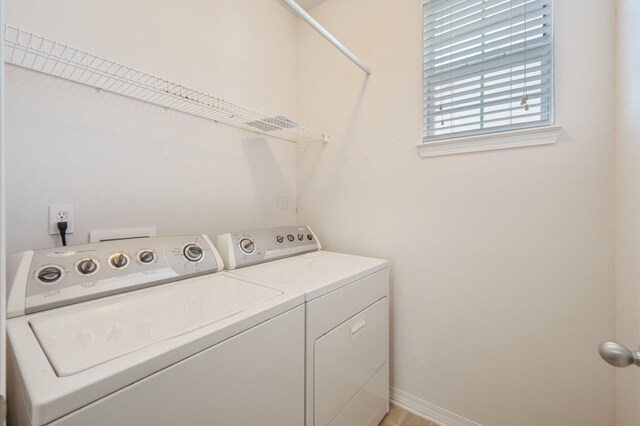 613 Prairie St, Crestview, FL 32536 - laundry room with washer and clothes dryer and baseboards