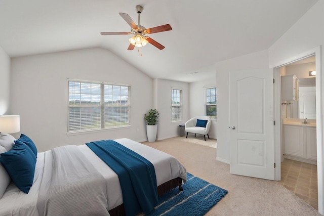 613 Prairie St, Crestview, FL 32536 - bedroom with light colored carpet, vaulted ceiling, a sink, and a ceiling fan