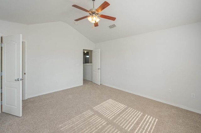 613 Prairie St, Crestview, FL 32536 - unfurnished bedroom featuring light colored carpet, lofted ceiling, baseboards, and a ceiling fan