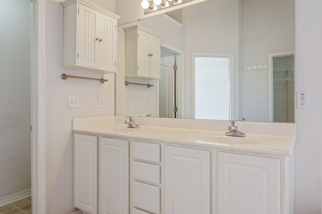 613 Prairie St, Crestview, FL 32536 - bathroom featuring double vanity and baseboards