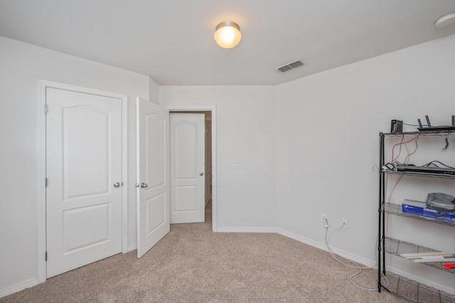 613 Prairie St, Crestview, FL 32536 - unfurnished bedroom featuring light colored carpet and baseboards