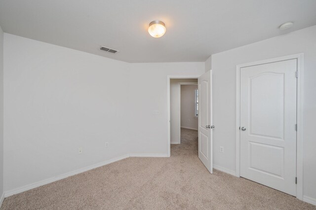 613 Prairie St, Crestview, FL 32536 - unfurnished bedroom with light colored carpet and baseboards