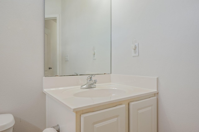 613 Prairie St, Crestview, FL 32536 - half bathroom featuring vanity and toilet