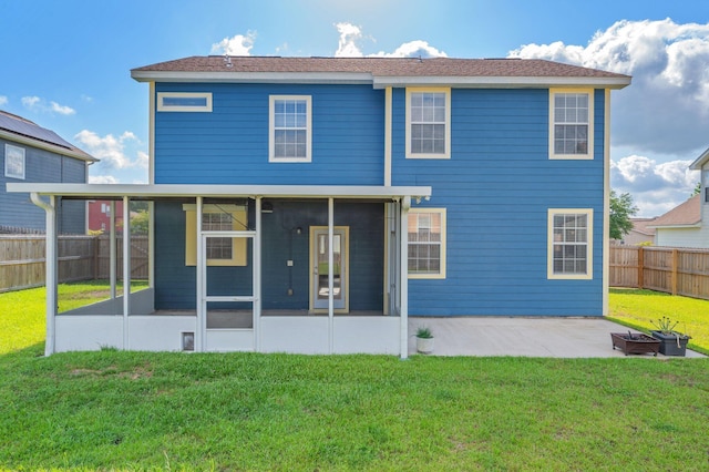 613 Prairie St, Crestview, FL 32536 - rear view of house with a sunroom, a patio, and an outdoor fire pit