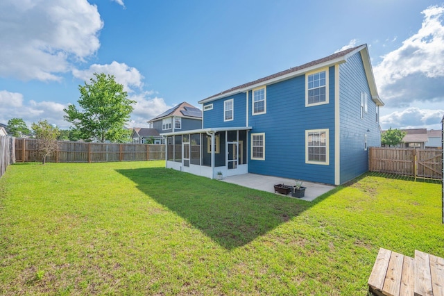 613 Prairie St, Crestview, FL 32536 - rear view of property with a sunroom and a patio area
