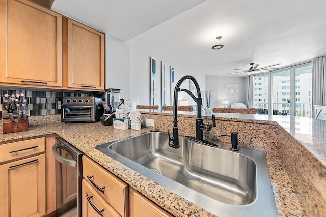 4207 Indian Bayou Trl Unit 2513, Destin, FL 32541 - kitchen with a sink, dishwasher, a ceiling fan, tasteful backsplash, and light stone countertops