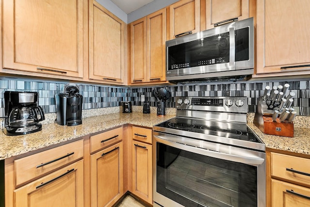 4207 Indian Bayou Trl Unit 2513, Destin, FL 32541 - kitchen featuring stainless steel appliances, light brown cabinetry, and tasteful backsplash