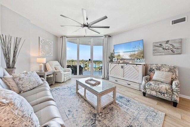 4207 Indian Bayou Trl Unit 2513, Destin, FL 32541 - living area featuring ceiling fan, expansive windows, and wood finished floors